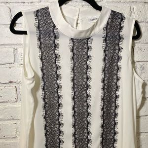 Like new silky white tank with black lace stripes.